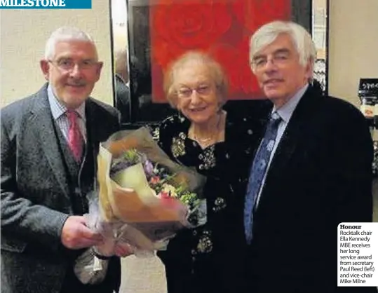  ??  ?? Honour Rocktalk chair Ella Kennedy MBE receives her long service award from secretary Paul Reed (left) and vice-chair Mike Milne