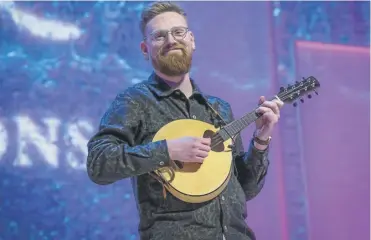  ?? PICTURE: ALAN PEEBLES ?? Singer, guitarist and mandolin player Calum Mcilroy is the new Young Traditiona­l Musician of the Year