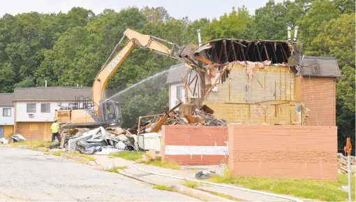  ?? PAUL W. GILLESPIE/CAPITAL GAZETTE PHOTOS ?? Demolition begins on the Newtowne 20 public housing community Thursday in Annapolis. The project has been delayed for years.