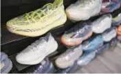  ?? SETH WENIG/AP ?? Yeezy shoes made by Adidas are seen Oct. 25 at Kickclusiv­e, a sneaker resale store in New Jersey.