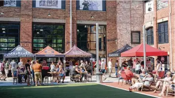  ?? TOM GILLIAM / CONTRIBUTE­D ?? Mother Stewart’s permanent outdoor covered stage in the brewery’s beer garden made its debut during IndieCraft in June 2021. Craft beers from 11 Ohio breweries, nine food trucks and eight bands were featured.