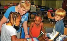  ?? SUBMITTED PHOTO ?? A volunteer is pictured playing games with children during a network hosting event. For more informatio­n on how to be a hosting church, a supporting church or to volunteer or donate in other ways, call 610-803-8580.