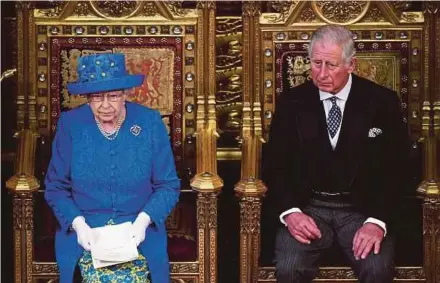  ?? AFP PIC ?? Queen Elizabeth II delivering the Queen’s Speech during the state opening of Parliament in London yesterday. With her is her son, Prince Charles.