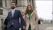  ?? CHARLIE NEIBERGALL — THE ASSOCIATED PRESS ?? Democrat Abby Finkenauer leaves the Iowa Supreme Court Building in Des Moines with her husband, Daniel Wasta, on Wednesday.