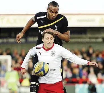  ??  ?? Heady stuff: Tottenham’s Younes Kaboul (top) challenges Stevenage’s Luke Freeman during their FA Cup match on Sunday. — Reuters