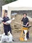  ??  ?? Civil Defence crews in Co Kerry get sandbags ready ahead of the hurricane