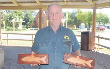  ??  ?? John Russell with the hand crafted winner’s trophies.