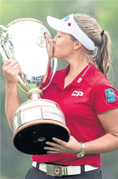  ?? JONATHAN HAYWARD THE CANADIAN PRESS ?? Brooke Henderson closed with a 7-under 65 to win the CP Women’s Open by four strokes. The Smiths Falls, Ont., golfer certainly didn’t seem nervous with nine birdies Sunday, including five on her final seven holes.
