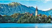  ?? DOMINIC ARIZONA BONUCCELLI/RICK STEVES’ EUROPE ?? One popular Ljubljana day trip is a visit to Lake Bled, which encircles a church-topped island and is ringed by peaks.