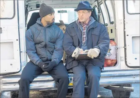  ?? Barry Wetcher
Warner Bros. Pictures ?? MICHAEL B. JORDAN, left, with co-star Sylvester Stallone in “Creed.” Though critics lauded Jordan’s performanc­e, he didn’t receive an Oscar nomination. Many voters told The Times that the #OscarsSoWh­ite controvers­y has made them scapegoats for the...