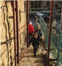  ?? (Issa Amro) ?? CHILDREN CLIMB up the Cordoba stairwell by Beit Hadassah in Hebron.