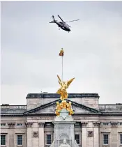  ?? ?? A helicopter believed to be carrying the King and Queen leaves Buckingham Palace in London