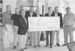  ?? STEVE WATERS/STAFF ?? The First Tee of The Palm Beaches received a $10,000 donation to maintain and enhance its 10-acre facility in West Palm Beach from the Palm Beach and Treasure Coast chapters of the Golf Course Superinten­dents Associatio­n of America.