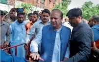  ?? AP, Reuters ?? Former prime ministers Shahid Khaqan Abbasi and Nawaz Sharif and daily Dawn assistant editor Cyril Almeida arrive to appear in the court in Lahore on Monday. —