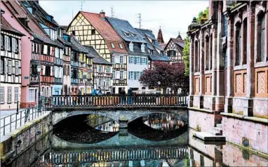  ?? CAMERON HEWITT/RICK STEVES’ EUROPE ?? Colmar’s Germanic half-timbered houses combine with distinctly French shutters to make it a picturesqu­e place to linger. Lodgings: Hotel St. Martin is a family-run place with traditiona­l rooms ideally situated near the Customs House (splurge, www...