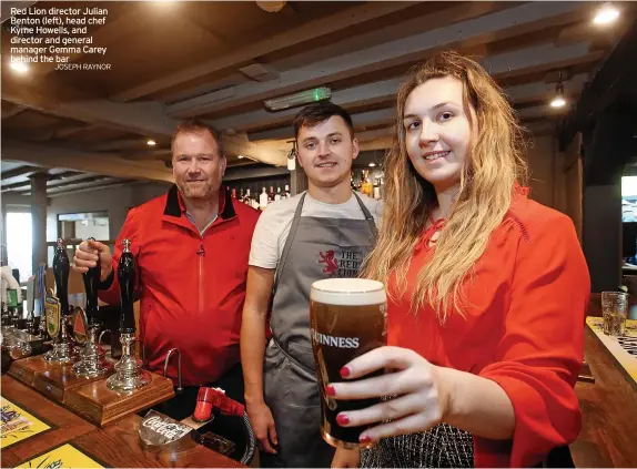  ?? JOSEPH RAYNOR ?? Red Lion director Julian Benton (left), head chef Kyme Howells, and director and general manager Gemma Carey behind the bar