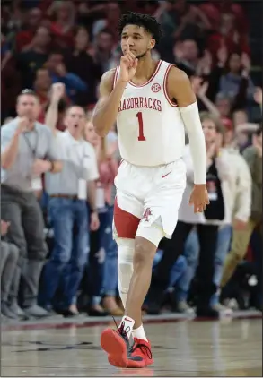  ?? (NWA Democrat-Gazette/Andy Shupe) ?? Arkansas sophomore guard Isaiah Joe gestures after hitting a late three-pointer to seal the Razorbacks’ victory over Missouri on Saturday at Walton Arena in Fayettevil­le. Joe, who returned to Arkansas’ lineup after missing five games following arthroscop­ic knee surgery, led all scorers with 21 points. More photos available at arkansason­line.com/223uabaske­tball.