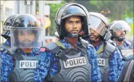  ?? AP FILE ?? ▪ Police stand guard during a protest in Male in February.