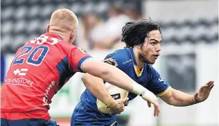  ?? PHOTO: PETER MCINTOSH ?? Closed down . . . Otago replacemen­t back Josh Timu is slowed by Tasman replacemen­t flanker Anton Segner.