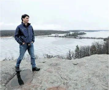  ?? LARS HAGBERG/THE CANADIAN PRESS ?? Prime Minister Justin Trudeau looks out over the Thousand Island National park in Gananoque, Ont., on Tuesday.