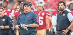  ?? JOHN HEFTI/USA TODAY SPORTS ?? Chip Kelly hired Ryan Day (in background, at far right) first with the Eagles and then the 49ers.