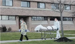  ?? NATHAN DENETTE TORONTO STAR FILE PHOTO ?? A body is wheeled from the Eatonville Care Centre, where multiple deaths from COVID-19 have occurred, in Toronto. Canadians should trust statistics from the pandemic, but understand they are not always infallible, writes Dr. Michael Multan.