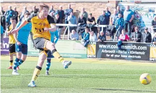  ?? ?? Annan’s Tony Wallace scores the winner from the penalty spot.