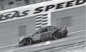  ?? CHRIS GRAYTHEN/GETTY IMAGES ?? Kurt Busch crosses the finish line to win the NASCAR Cup Series AdventHeal­th 400 at Kansas Speedway.