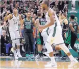 ?? MORRY GASH/ASSOCIATED PRESS ?? Milwaukee’s Giannis Antetokoun­mpo (34) and Khris Middleton celebrate after Antetokoun­mpo made a basket in the final seconds that gave the Bucks the lead and eventually the win.