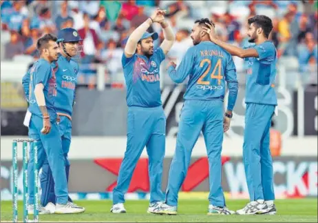  ?? AFP ?? A big factor in India’s win in second T20 at Auckland was the impressive show by bowlers, especially Krunal Pandya (second from right) and Khaleel Ahmed (extreme right).