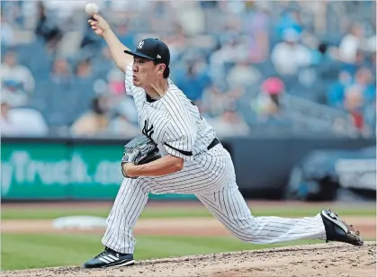  ?? KATHY WILLENS THE ASSOCIATED PRESS ?? Yankees’ Masahiro Tanaka delivers against the Toronto Blue Jays on Sunday. Tanaka was the winning pitcher in the Yankees’ 4-2 victory.