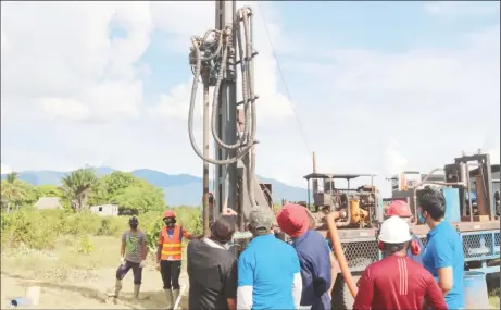  ??  ?? Minister of Housing and Water, Collin Croal and a team of GWI and Regional Officials at the well drilling site in Shulinab. (GWI photo)