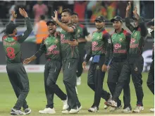  ?? AFP ?? Bangladesh players celebrate taking a wicket during their 137-run drubbing of Sri Lanka in Dubai