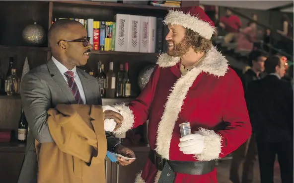  ?? — PARAMOUNT ?? Courtney B. Vance, left, and T.J. Miller star in 2016’s Office Christmas Party, a ‘musty old gift wrapped in shiny new paper.’