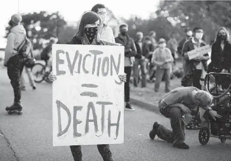  ?? MICHAEL DWYER/AP ?? Activists gather in front of Gov. Charlie Baker’s house in October in Swampscott, Mass. Renters are still being evicted during the coronaviru­s pandemic despite a federal order.