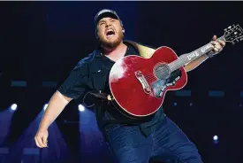  ?? PHOTO BY AMY HARRIS/INVISION/AP ?? Luke Combs performs during CMA Fest 2022 on June 11 at Nissan Stadium in Nashville, Tennessee.