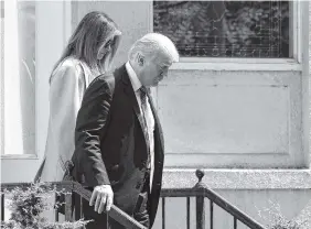  ?? THE ASSOCIATED PRESS ?? President Donald Trump and first lady Melania Trump leave after attending Sunday services at St. John’s Church in Washington.
