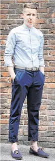  ??  ?? Ryan Nugent wearing a blue grandad collar shirt from Farrah (€75), navy Penguin trousers (€70), a grey Ted Baker belt (€39) and navy Kurt Geiger shoes (€70) all from Arnotts Menswear