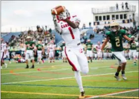  ?? JAMES BEAVER — FOR DIGITAL FIRST MEDIA ?? Archbishop Carroll’s Koran Butler hauls in a long touchdown pass from Russell Minor-Shaw in a 31-7 win over Lansdale Catholic Saturday.