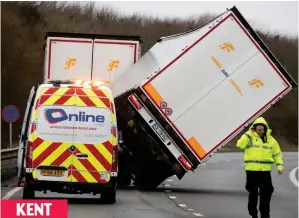  ??  ?? Blow me down! A blast of wind topples a truck near Dover