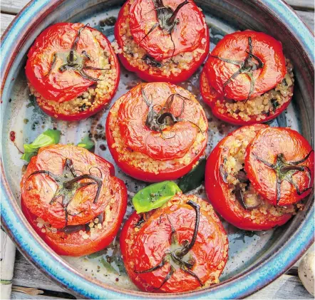  ?? — THE ASSOCIATED PRESS ?? Tomatoes can be stuffed with quinoa or brown rice and you can use whatever vegetables you have on hand. If you, must you can even add a little meat.