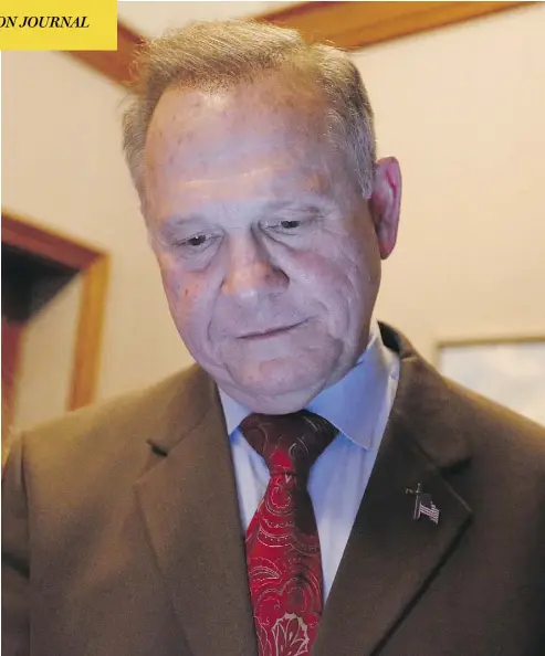 ?? BRYNN ANDERSON/THE ASSOCIATED PRESS ?? Republican U.S. Senate candidate Roy Moore looks at election returns during a watch party in Montgomery, Ala. Doug Jones defeated Moore to become the first Democratic senator elected in a quarter-century in the state.