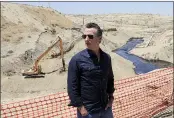  ?? IRFAN KHAN — LOS ANGELES TIMES VIA AP ?? Gov. Gavin Newsom tours the Chevron oil field west of Bakersfiel­d, where a spill of more than 800,000gallons flowed into a dry creek bed.