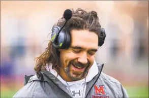  ?? Hearst Connecticu­t Media ?? McMahon football coach Jeff Queiroga, shown during a game against Norwalk in November, donates his hair to a charity that makes wigs for pediatric cancer patients. During the COVID-19 pandemic, Queiroga and fellow McMahon teacher Nick Banas started a program that provided nearly 2,000 meals to Norwalk residents.