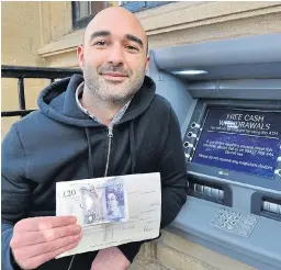  ?? Picture: SWNS ?? Steve Titman with his cheque for £20 which was refunded by his bank NatWest after a cash machine mishap