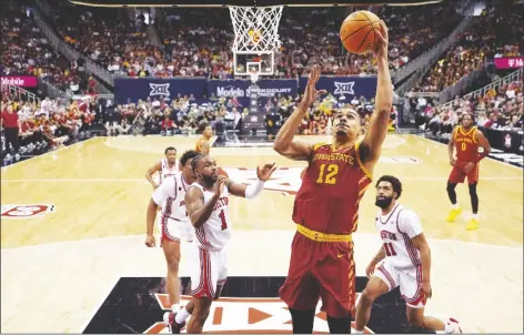  ?? CHARLIE RIEDEL/AP ?? IOWA STATE FORWARD ROBERT JONES (12) shoots during the first half of a game against Houston in the championsh­ip of the Big 12 Conference tournament on Saturday in Kansas City, Mo.