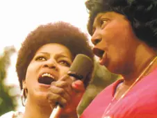  ?? Searchligh­t Pictures 1969 ?? Mavis Staples (left) and Mahalia Jackson perform at the Harlem Cultural Festival in 1969.
