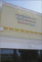  ?? EVAN TUCHINSKY — ENTERPRISE-RECORD ?? The Chico Children’s Museum radiates its sunny hue Wednesday in downtown Chico. The color raised concerns during the building’s architectu­ral review.