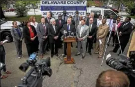  ?? RICK KAUFFMAN — DIGITAL FIRST MEDIA ?? Delaware County District Attorney Jack Whelan, center, speaks at a press conference Wednesday at the location of first homicide of 2017 in Chester at 22nd Street and Edgmont Avenue.