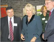  ?? ?? A new ambulance presented to the hospital during the opening ceremony in 1937; the Duchess of Cornwall visited the osteoporos­is unit in 2010